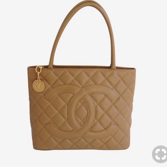 CHANEL Handbags - Chanel tan quilted medallion bag